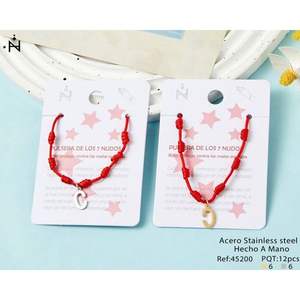 Pulsera de siete nudos con hilo rojo y acero inoxidable, hecha a mano para la suerte y protección, unisex, para uso diario. - Product Image 1