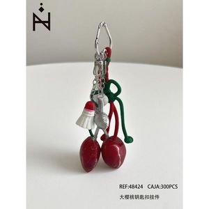 Portachiavi con Grande Ciondolo a Forma di Ciliegia Rossa con Gancio Argentato e Corda Verde, Accessorio di Moda - Product Image 3