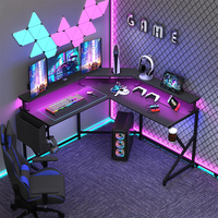 Grand bureau de jeu noir en forme de L avec lumières LED et prises de courant table de jeu pour PC gamer pour bureau à domicile