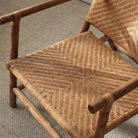 Fauteuil de salon minimaliste en rotin naturel tressé avec structure en bois massif