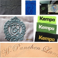 Máquina de grabado de logotipo de goma de silicona industrial para etiquetas de cuero de tela Fabricación personalizada Fábricas de accesorios de ropa
