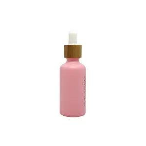 Botella cuentagotas de vidrio rosa con tapa de bambú para embalaje de aceite de cabello cosmético