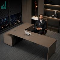 Bureau de direction moderne de luxe en forme de L, placage en bois d'ébène gris avec armoire latérale et pieds robustes en angle droit pour bureau d'entreprise