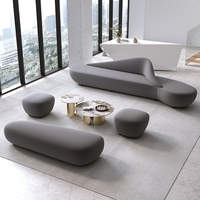Canapé d'angle en velours de luxe sur mesure OEM/ODM avec table basse, directement de l'usine pour designers d'intérieur et halls d'hôtel, canapé incurvé