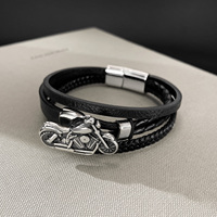 Bracelet à boucle magnétique en cuir tressé européen américain fait à la main pour hommes en acier inoxydable breloque à la mode pour hommes