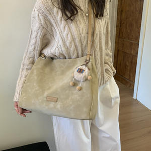 Brownish-<b>yellow</b> suede shoulder <b>bag</b> with a sweet, plush charm; women's handbag. - Product Image 6