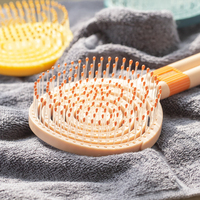 Brosse à cheveux professionnelle OEM incurvée et ventilée, fonction démêlante et séchante, avec peigne à queue, manche en nylon, peignes de soin capillaire emballés