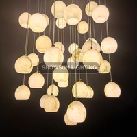 Lustre moderne de luxe créatif en pierre d'albâtre ronde pour salon, restaurant, escalier, décoration de la maison, luminaire suspendu
