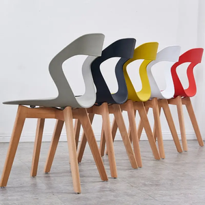 Hot sale special style dining room furniture sturdy and durable wooden leg pp stackable plastic dining chairs