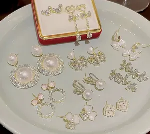 Anting-anting mutiara busur berkilau mulia perhiasan Fashion berlapis emas gaya kustom untuk wanita pabrik grosir