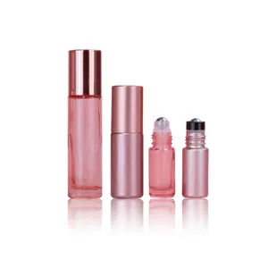 Botella enrollable de vidrio/acero rosa de 5ml y 10ml vacía al por mayor con tapa de oro rosa para embalaje de perfume de suero de aceite esencial