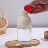 Bouteille d'eau en verre portable et écologique, anti-fuite, en borosilicate, avec nez rouge créatif, finition mate, avec couvercle, idéale pour un cadeau quotidien