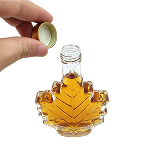 Bouteilles diffuseuses en verre <span class=keywords><strong>de</strong></span> luxe en forme <span class=keywords><strong>de</strong></span> feuille d'érable pour sirop contre la toux, vin, whisky, <span class=keywords><strong>gin</strong></span>, boissons, avec couvercle - Product Image 1