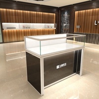 Mostrador de tienda minorista de oro de lujo, mesa de exhibición de diseño, joyería, muebles, escaparates de joyería de cristal, luces Led
