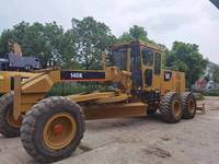 Niveleuse Caterpillar 140K d'origine, faible nombre d'heures de fonctionnement, bon état, en stock, matériel de construction routière