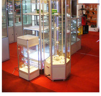 CHIXIANG Maßgefertigte Glas-Drehvitrine mit LED-Beleuchtung und Rädern Schmuck- & Kosmetik-Displays für Einzelhandelsgeschäfte