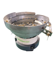 Bol d'alimentation pour atomiseurs avec trémie de vibration