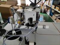 Machine à coudre surjeteuse automatique à cylindre circulaire DS-8400TD-04M2-24-7-P/ACC pour l'attache de colliers