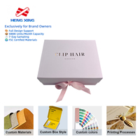Boîte cadeau rigide HENGXING violet clair avec gaufrage, revêtement UV, nœud en soie et logo en feuille d'or pour emballage de perruques de cheveux naturels certifiées