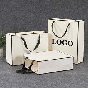 KM Customized Boutique Jewellery Golden Supplier Recycled <b>Gift</b> Paper <b>Bags</b> Wholesale with Ribbon Handle - Product Image 1