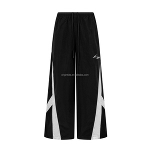 Pantalon de jogging noir à jambes larges pour homme, taille élastique avec cordon de serrage, devant plat, color block, pantalon décontracté pour homme - Product Image 1