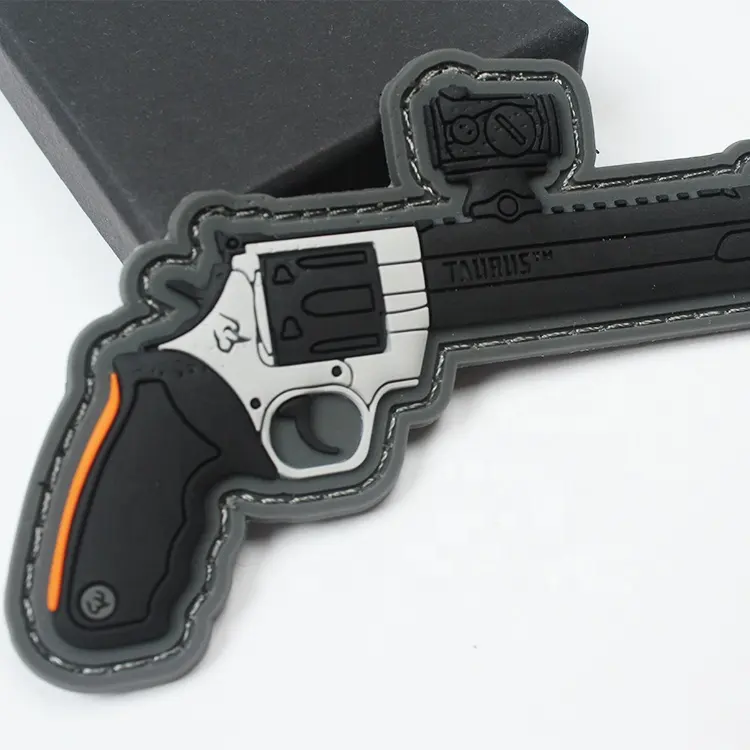 Cheaper Custom 3D Embossed Gun Logo Hook Backing PVC Silicone Patches for Clothing