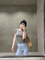 Été Nouveau 2.0 Yoga de course pour les dames Séchage rapide à manches courtes Col sans couture Anti-boulochage Base Show Waist Hip Women's T-Shirts