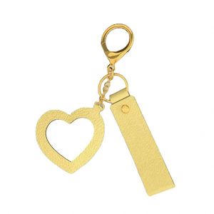 Porte-clés miroir en forme de cœur en cuir PU avec logo personnalisé, accessoire suspendu mignon et créatif - Product Image 1