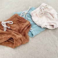 Vente en gros Maillot de bain une pièce à texture côtelée solide pour tout-petits filles Barboteuse en velours mélangé de coton extensible pour enfants Vente en gros