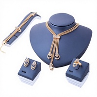 Ensemble de mariée créatif en alliage de zinc plaqué or, orné de cristaux exagérés, collier, boucles d'oreilles et bague, quatre pièces, best-seller transfrontalier