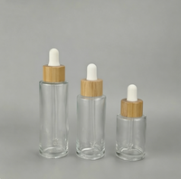 Flacon compte-gouttes en verre ambré transparent givré de 30 ml, 50 ml, 60 ml avec bouchon compte-gouttes en bambou pour emballage de soins de la peau
