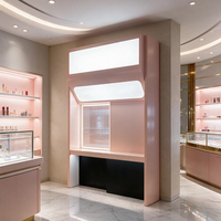 Expositor de pie rosa Millennial con caja de luz superior y mostrador de ventana empotrado, vitrina independiente para boutique