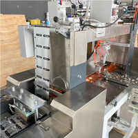 Machine d'emballage automatique haute vitesse pour préservatifs individuels avec gaufrage et collage d'emballages en papier de qualité alimentaire