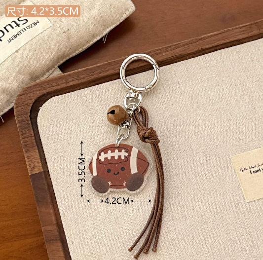 Joli pendentif boule - ballon de rugby