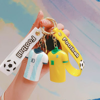 Ventes en gros de maillots de football, porte-clés cadeaux, jouets de football, acceptation de logo personnalisé, cadeau de fête, jouet capsule pour enfants et adultes