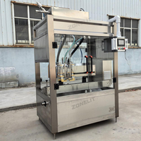 Servopompe à 4 buses Machine de remplissage automatique de liquide visqueux pour le suivi des bouteilles d'huile moteur avec convoyeur