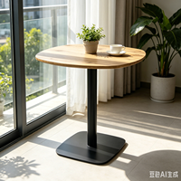 Table de bar ronde peu encombrante pour petits appartements, plateau en bois clair avec base en métal noir, idéale pour balcon ou coin café
