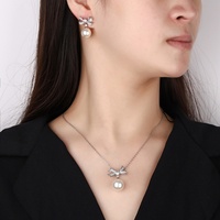Ensemble de bijoux de mariage pour femme, boucles d'oreilles et collier en cuivre écologique, perles de coquillage blanches 14-12mm, design croix, anti-ternissement, vente en gros