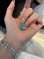 Bague de fiançailles en or 18 carats avec diamant de laboratoire bleu Paraiba taille ovale de luxe et bande pavée torsadée pour femme