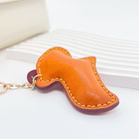 Porte-clés et breloque de sac créatif transfrontalier en cuir véritable, motif mini capybara dessin animé enfantin, cousu à la main