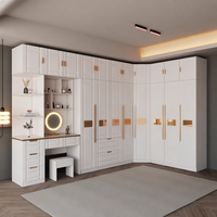 Meubles de chambre à coucher modernes et luxueux, armoire d'angle en panneaux de particules MDF personnalisés avec table de toilette intégrée