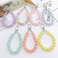 Lanière de téléphone à perles de nacre, bracelet anti-perte, breloque tendance, porte-clés, décoration de portefeuille, pendentif pour femmes