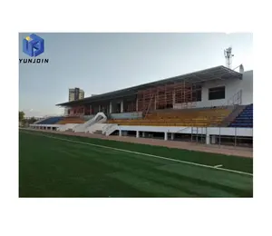 โครงสร้างเหล็กสําเร็จรูป Yunjoin กีฬาฟุตบอลสนามกีฬาหลังคาอัฒจันทร์พร้อมการออกแบบคานยกกรอบพื้นที่
