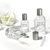 Fabricant en gros sur mesure de luxe vide cylindre rond atomiseur de parfum 30ml 50ml 100ml bouteille de parfum en verre