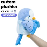 Marionnette à main OEM personnalisée en forme de perroquet bleu moelleux, design d'oiseau de dessin animé mignon, sûre et durable pour le jeu de rôle des tout-petits