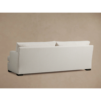 Canapé modulaire moderne en tissu performant résistant aux taches, silhouette élégante et larges accoudoirs, meubles de luxe