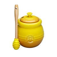 Pot de miel en céramique jaune avec louche pour le stockage des aliments et l'usine de conteneurs en gros 500ml