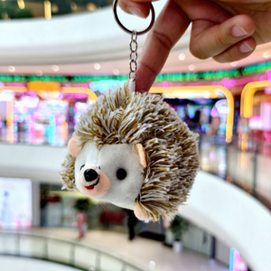 Vente en gros de jouets en peluche mignons et doux, porte-clés en forme de hérisson en peluche avec rembourrage en coton PP, petite taille pour tous les âges, unisexe - Product Image 1