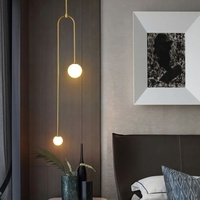 Lustre suspendu de chambre à coucher de luxe minimaliste moderne nordique, lampe créative en verre en forme de boule, LED dorée en U, très tendance