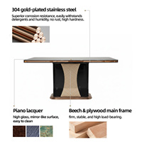 Table à manger noire haute brillance avec bordure or rose et chaises en cuir beige, ensemble salle à manger